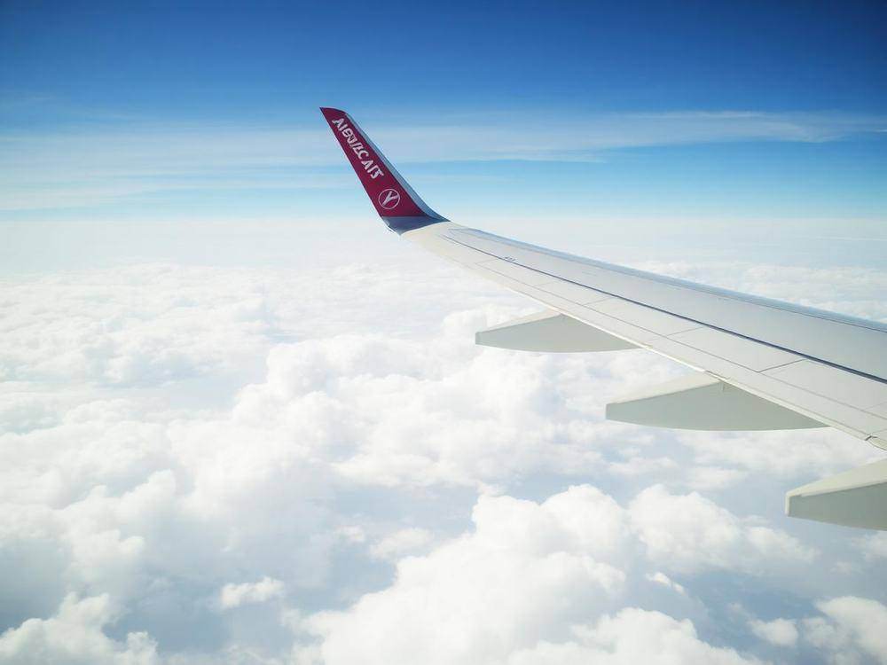 Aircraft wing above the clouds
