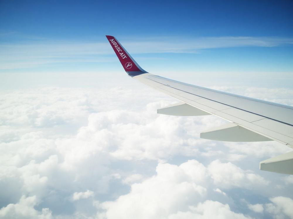 Aircraft wing above the clouds